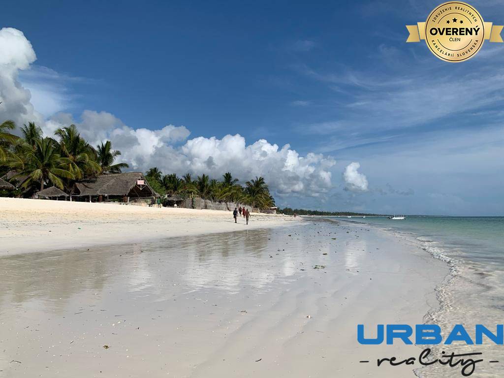 walking on the beach near villa with bright white sand.jpg