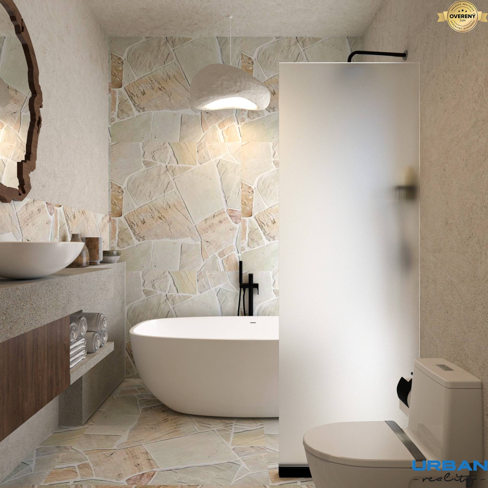 Kúpeľňa so samostatnou vaňou, umývadlom, toaletou a kamenným obkladom v 4-izbovom byte.