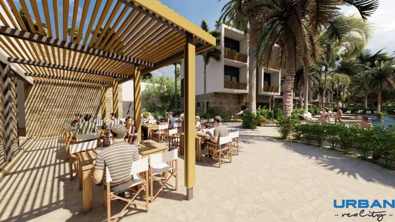 A10 lush tropical restaurant terrace with ocean breeze vela zanzibar residences.jpg