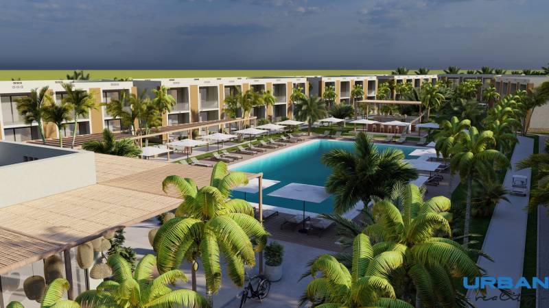 Moderný rezort s bazénom a palmami v meste Paje, obklopený 3-izbovými bytmi.