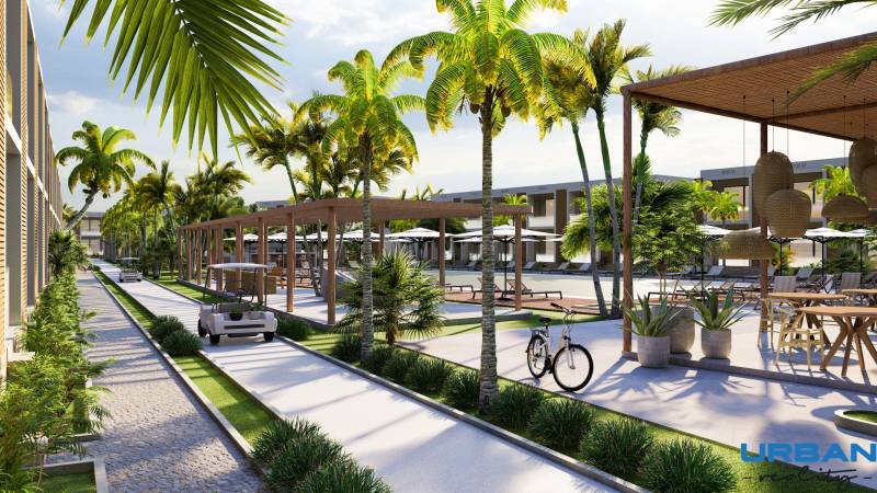 Palmy, cestičky, golfové vozíky a odpočívadlá vo výstavbe bytov v Paje.